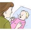 Hier sehen Sie eine Frau, die mit einem kleinen Baby spielt